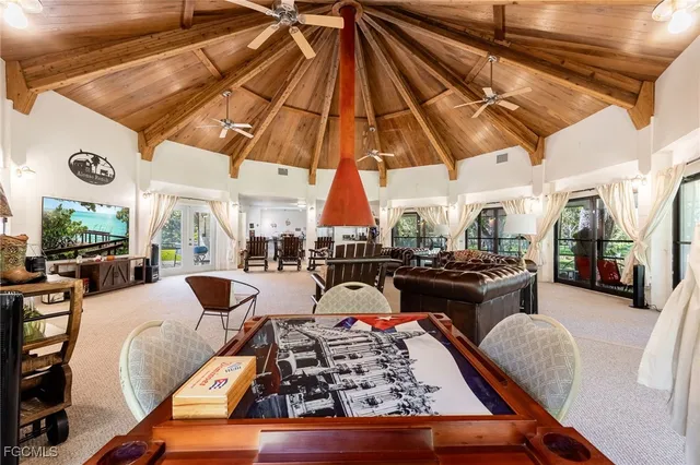 a living room with furniture and a umbrella