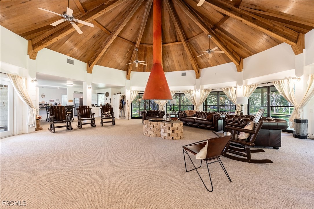 1400 Catamount Road LaBelle, FL 33935 - Photo 14 of 50 a view of a patio with table and chairs under an umbrella