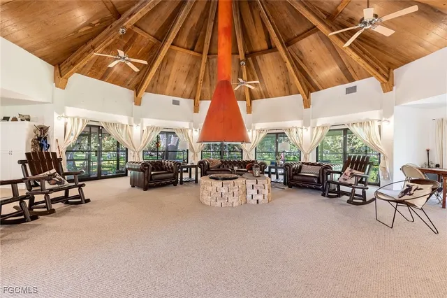a view of a tables and chairs under an umbrella