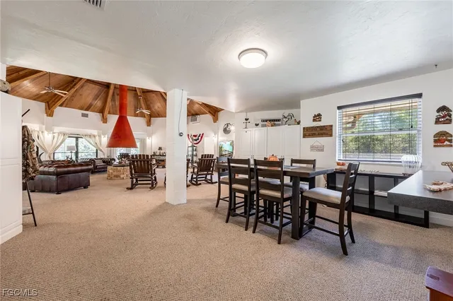 a view of a livingroom with furniture and a window