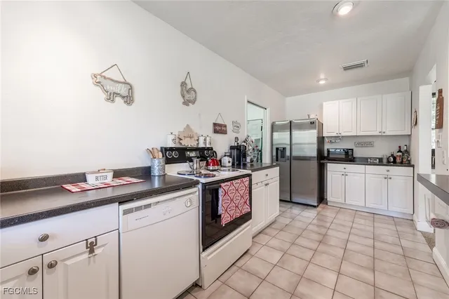 a kitchen with a sink cabinets and window
