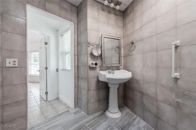 a bathroom with a sink shower