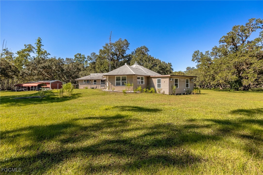 1400 Catamount Road LaBelle, FL 33935 - Photo 33 of 50 a view of a house with a yard