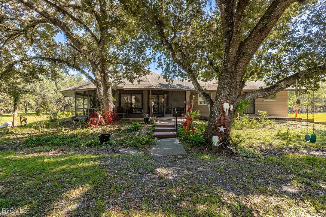 1400 Catamount Road LaBelle, FL 33935 - Photo 4 of 50 a view of a house with a tree in a yard