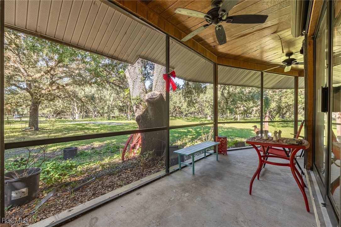 1400 Catamount Road LaBelle, FL 33935 - Photo 8 of 50 a view of a porch with furniture and a yard