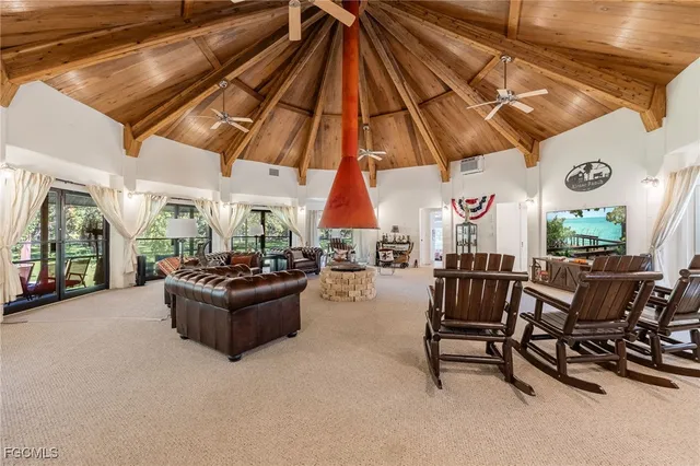 a living room with furniture and a umbrella