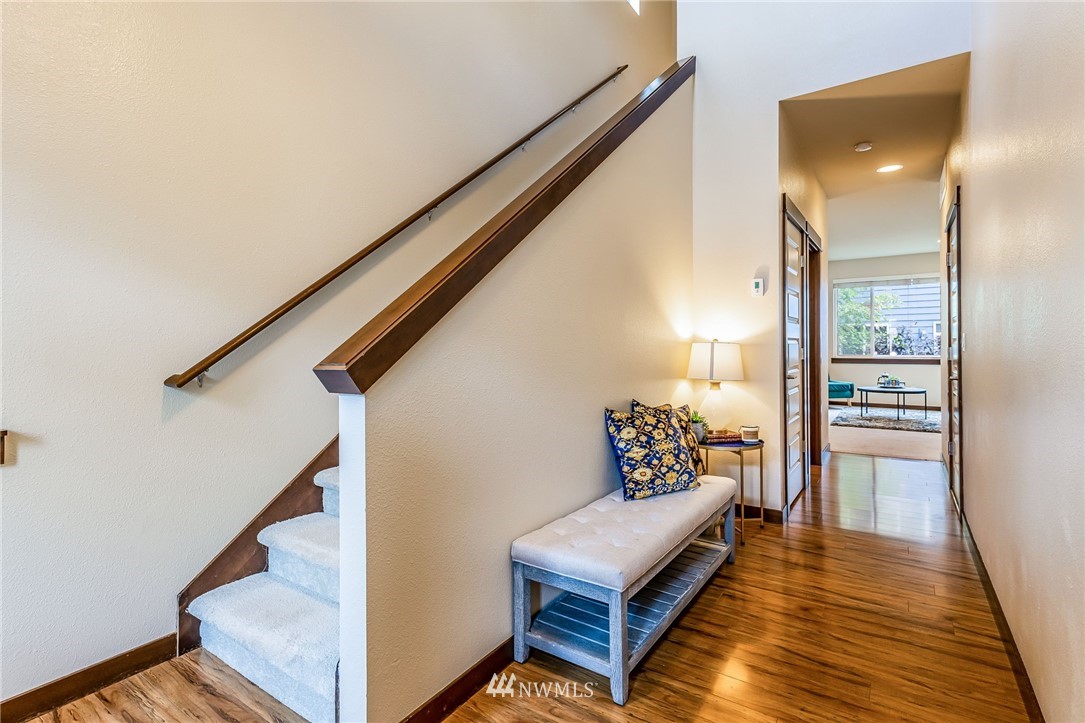 413 203rd Place Southeast Bothell, WA 98012 - Photo 22 of 38 a living room with furniture and a wooden floor