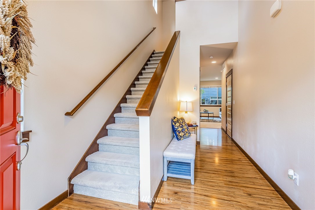 413 203rd Place Southeast Bothell, WA 98012 - Photo 6 of 38 a view of entryway and hall with wooden floor