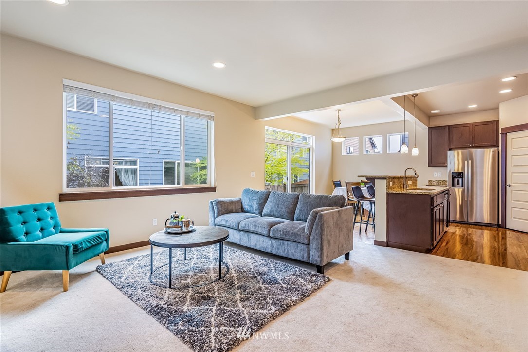 413 203rd Place Southeast Bothell, WA 98012 - Photo 7 of 38 a living room with furniture and a large window
