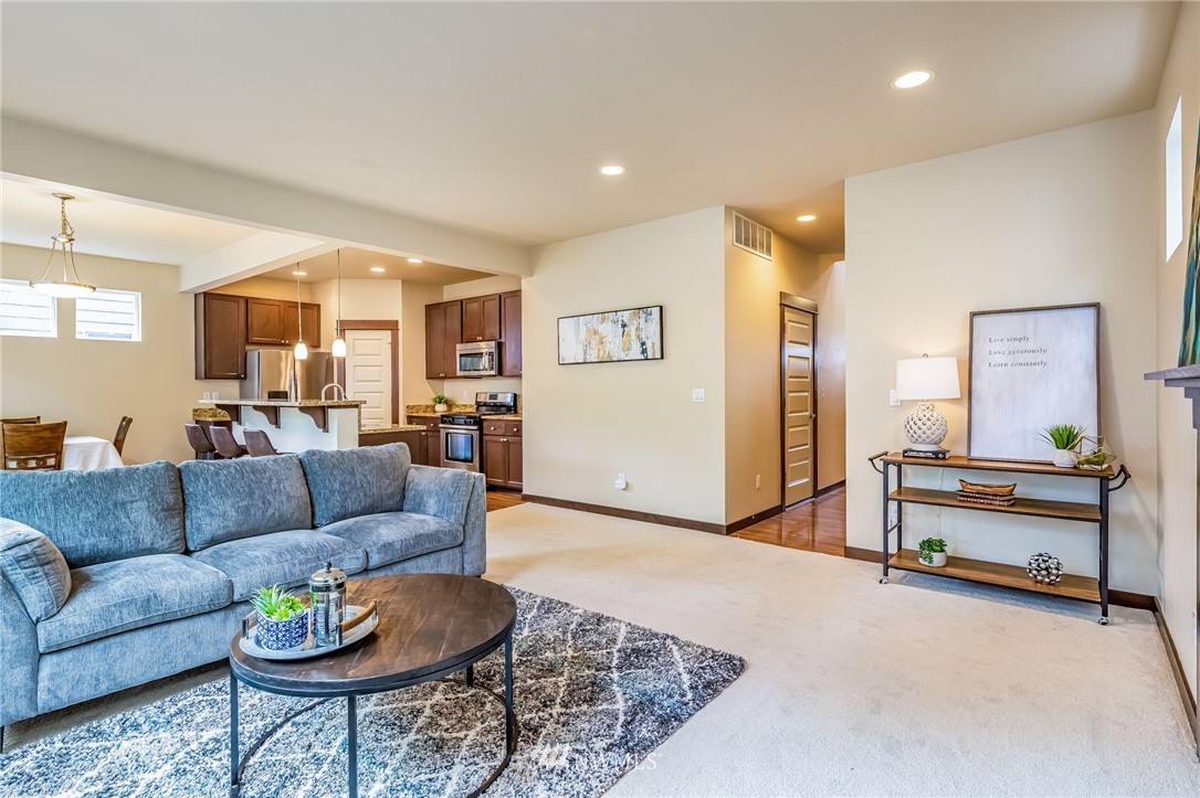 413 203rd Place Southeast Bothell, WA 98012 - Photo 8 of 38 a living room with furniture and a view of kitchen