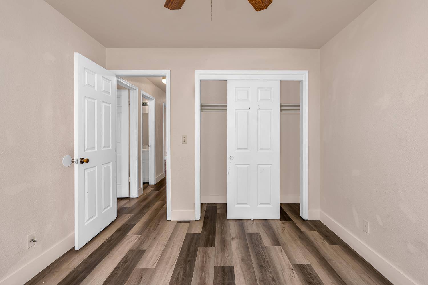 2408 Beatrice Lane Modesto, CA 95355 - Photo 16 of 36 a view of a room with wooden floor and gate