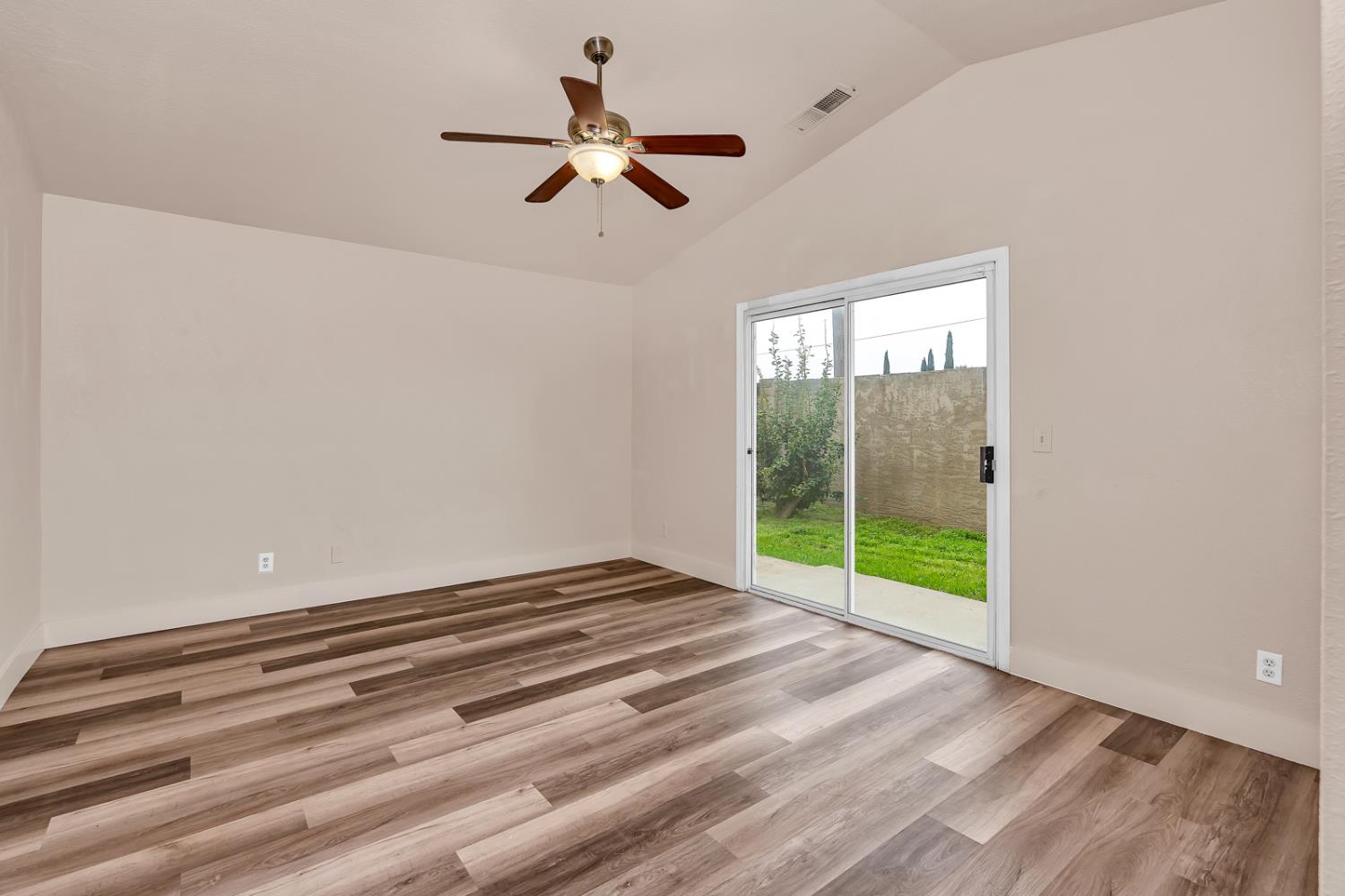 2408 Beatrice Lane Modesto, CA 95355 - Photo 22 of 36 a view of empty room with wooden floor