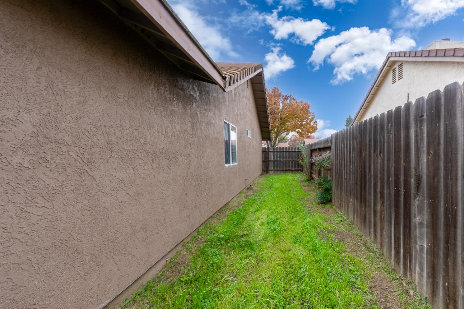 2408 Beatrice Lane Modesto, CA 95355 - Photo 29 of 36 a backyard of a house with lots of green space