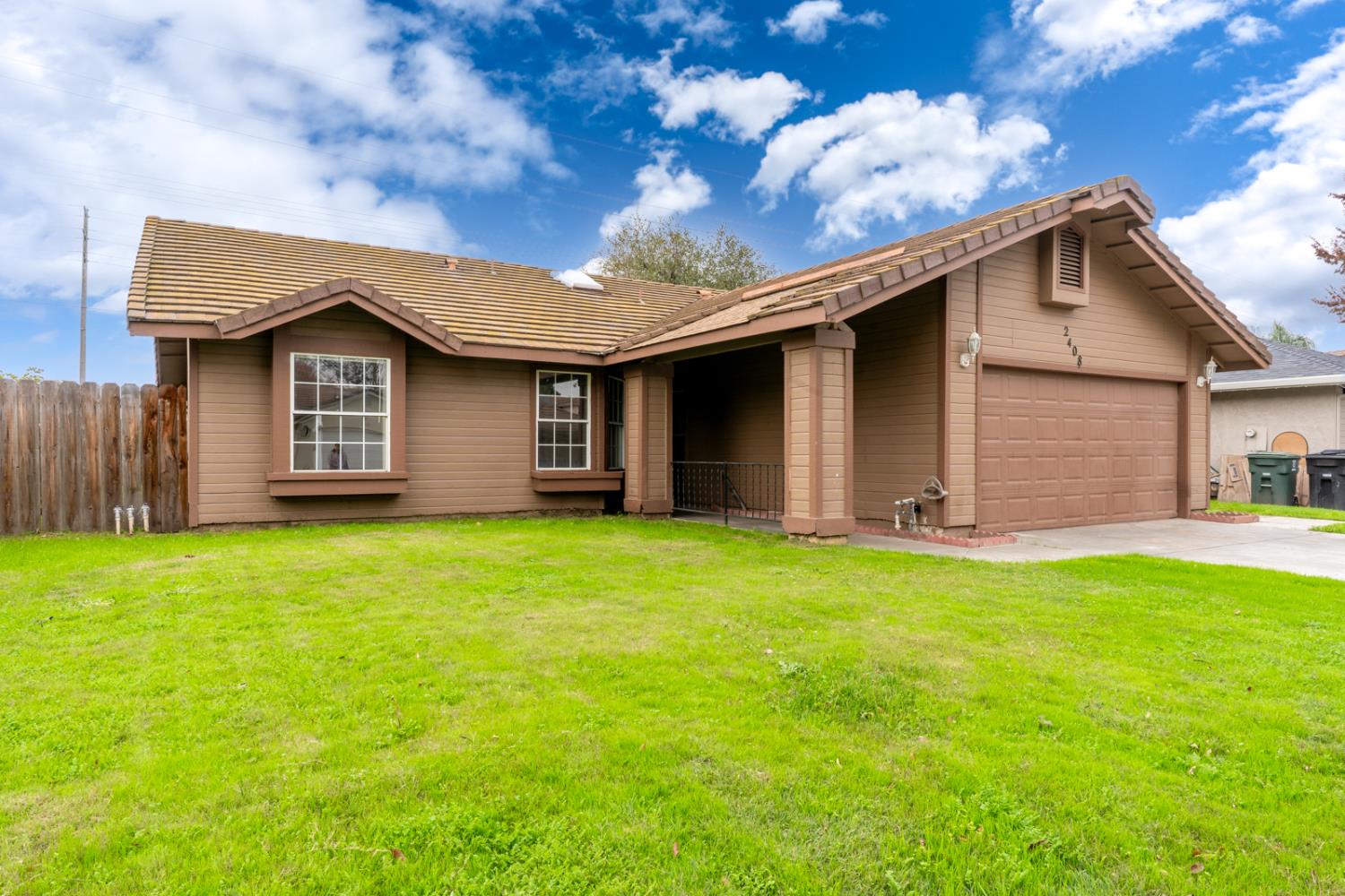 2408 Beatrice Lane Modesto, CA 95355 - Photo 3 of 36 a house view with a garden space