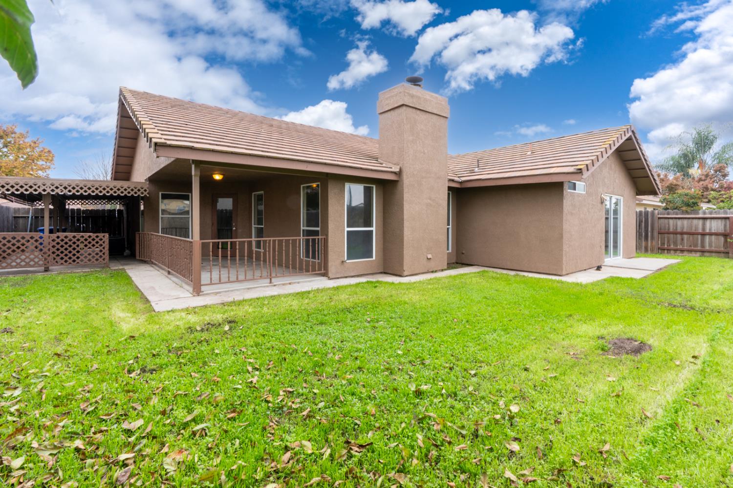 2408 Beatrice Lane Modesto, CA 95355 - Photo 31 of 36 a front view of a house with garden