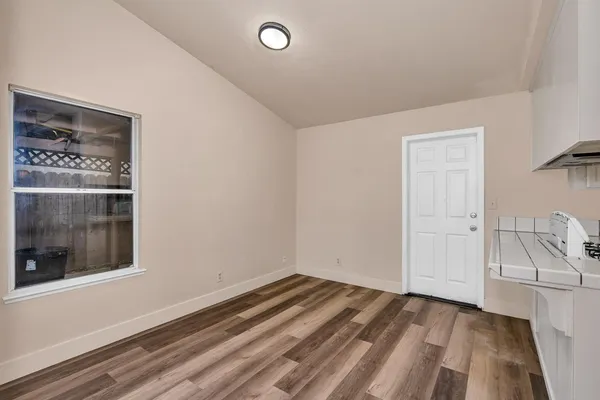 a view of a room that has a bed and a window