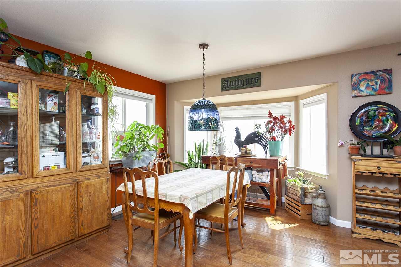 1931 Morgan Road Reno, NV 89521 - Photo 9 of 40 a view of a dining room with furniture window and wooden floor