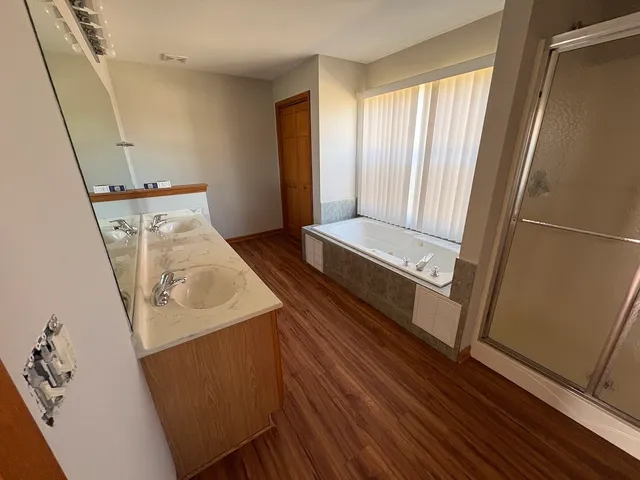 a view of front door with wooden floor