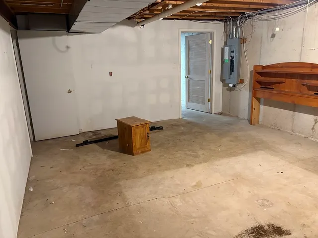 a view of a room with a refrigerator
