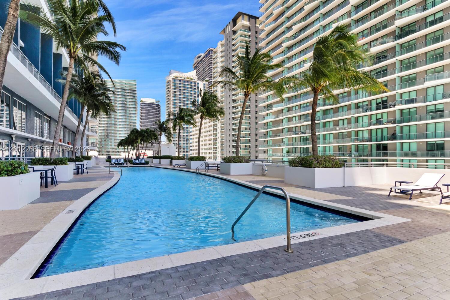 60 Southwest 13th Street, Unit 4005 Miami, FL 33130 - Photo 27 of 27 a view of a swimming pool with a patio