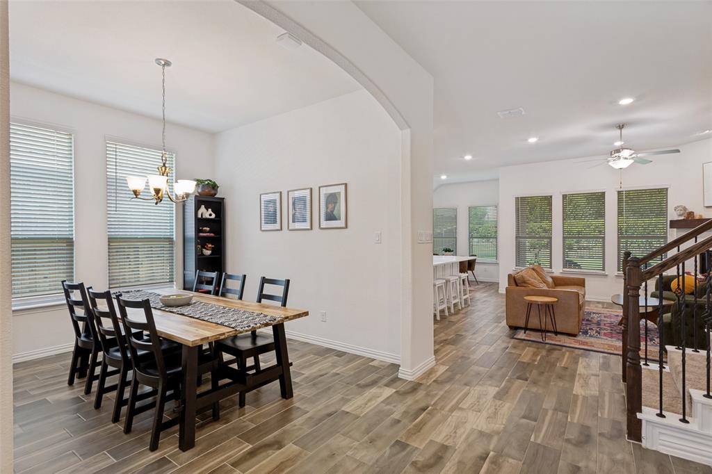 5556 Vaquero Road Fort Worth, TX 76126 - Photo 6 of 25 Dedicated dining space with great lighting/chandelier and wood-look flooring throughout.