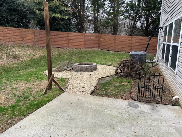 a view of a backyard with sitting area