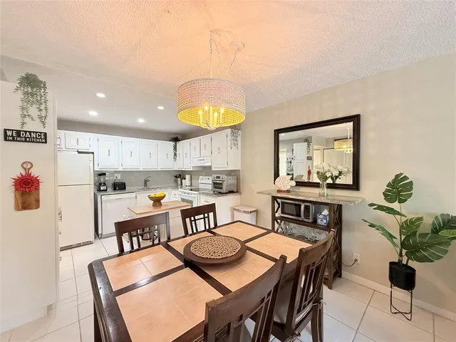a view of kitchen with cabinets and wooden floor