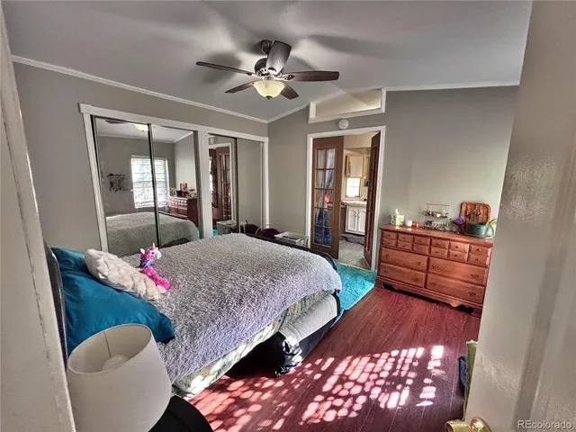 a bed room with a bed and a chandelier