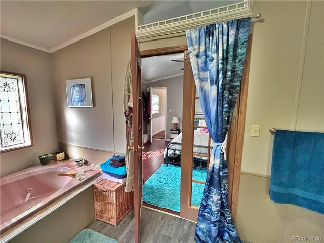 a bath tub sitting next to a blue sink