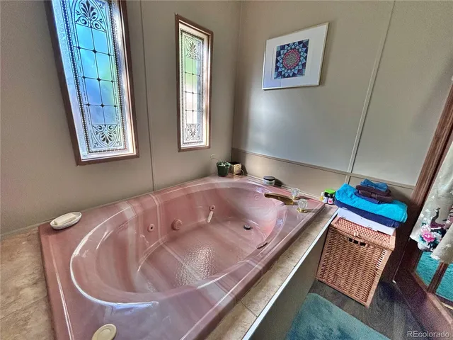 a bathroom with a double vanity sink toilet and shower