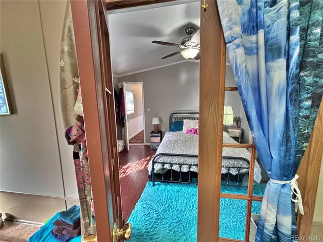 a hallway with chairs and wooden floor