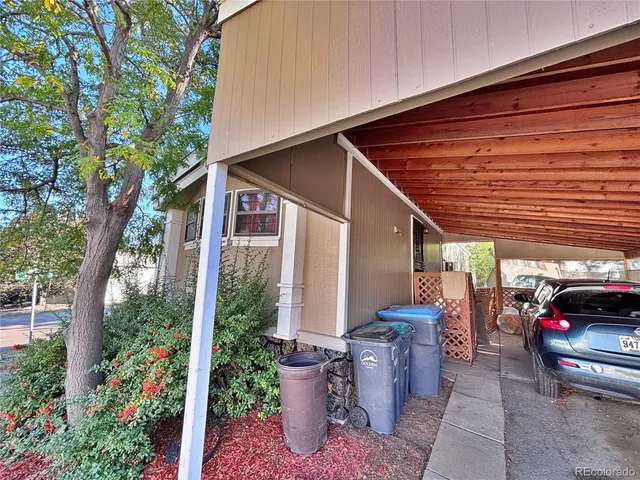 a front view of a house with garden and patio