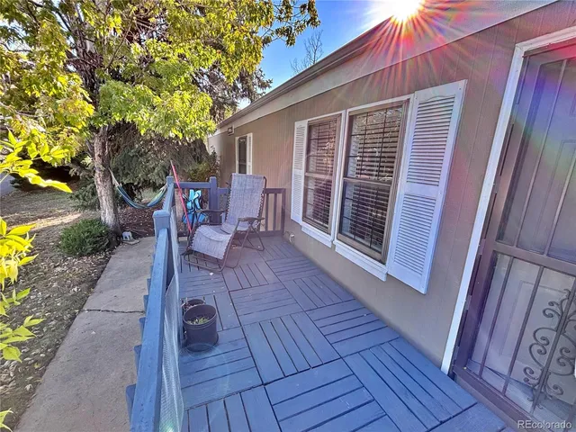 a view of a two chairs in the balcony