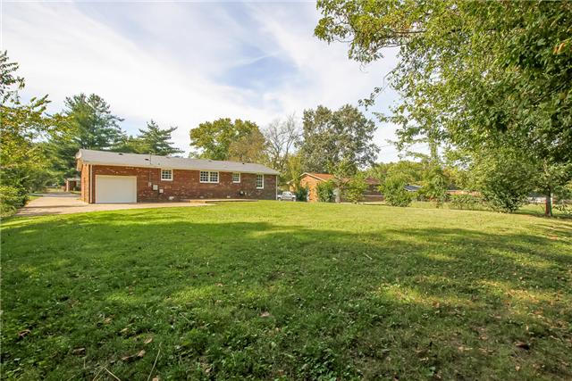 613 Paddy Run Road Clarksville, TN 37042 - Photo 4 of 20 Large fenced in backyard with new garage door. Great patio for entertaining.
