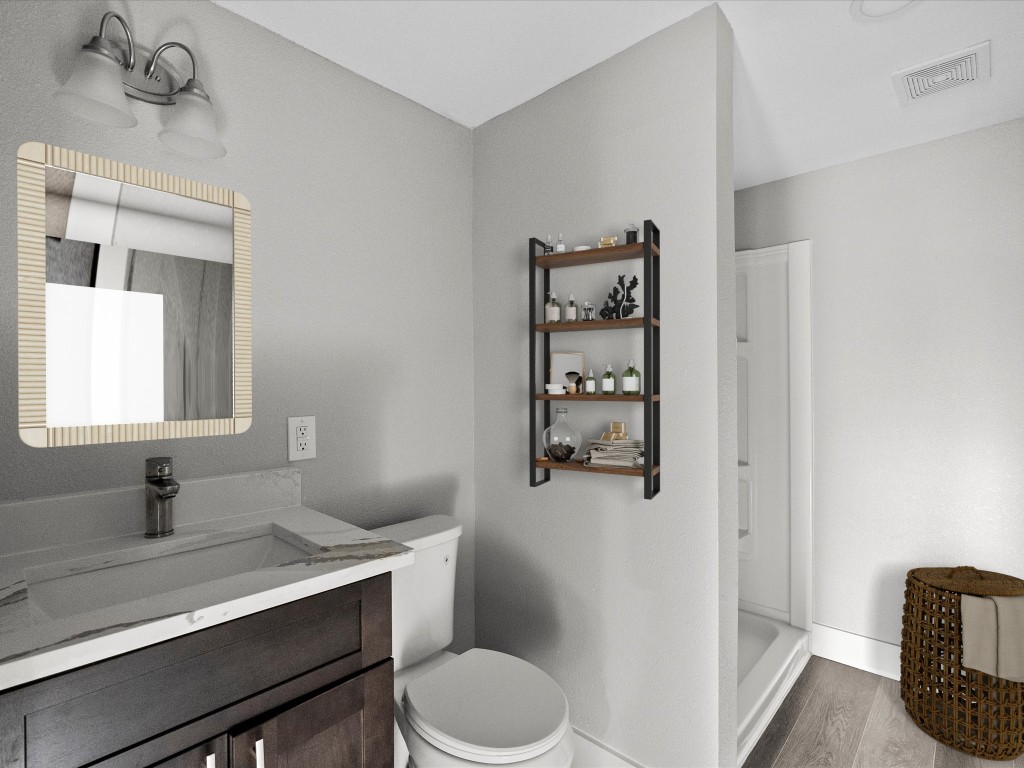 246 18th Street San Leon, TX 77539 - Photo 14 of 20 a bathroom with a toilet sink and mirror
