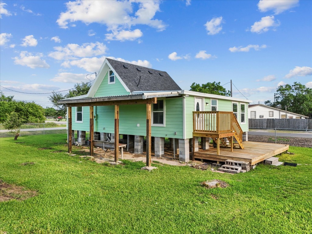 246 18th Street San Leon, TX 77539 - Photo 17 of 20 a view of a house with backyard sitting area and garden