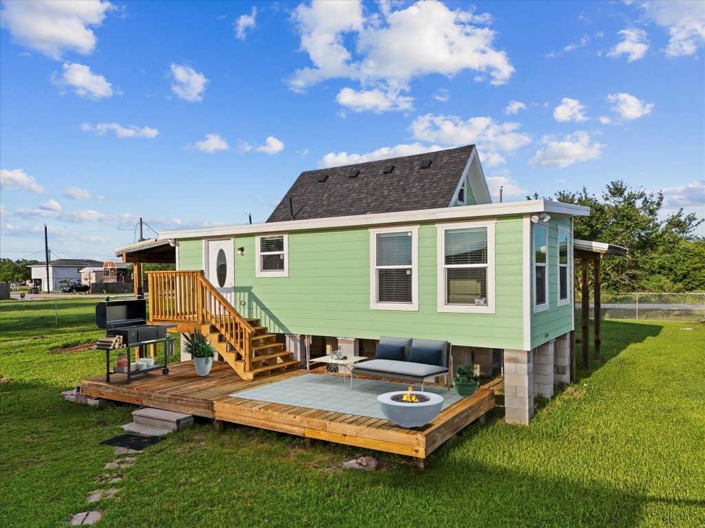 246 18th Street San Leon, TX 77539 - Photo 4 of 20 a front view of house with a garden and outdoor seating
