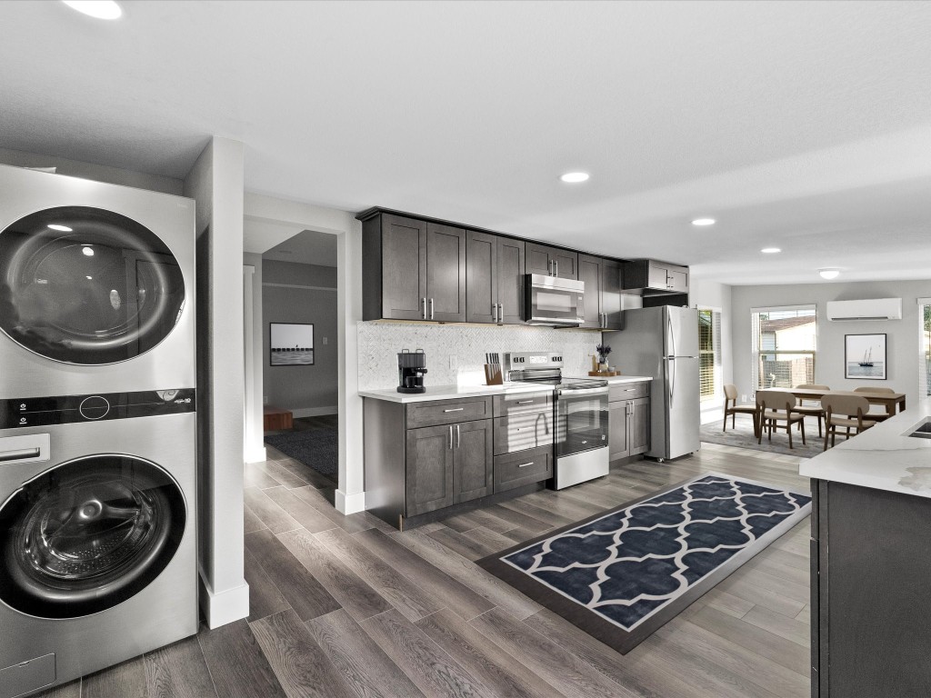 246 18th Street San Leon, TX 77539 - Photo 6 of 20 a kitchen with a stove and a refrigerator