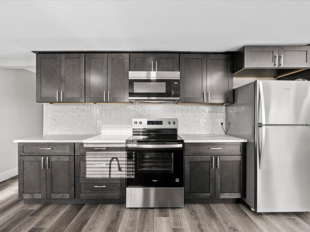 246 18th Street San Leon, TX 77539 - Photo 8 of 20 a kitchen with a stove and a refrigerator