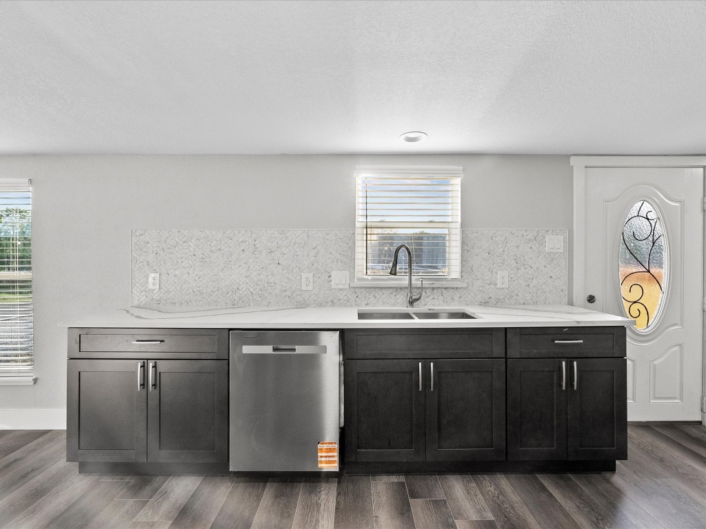 246 18th Street San Leon, TX 77539 - Photo 9 of 20 a kitchen with a sink and cabinets