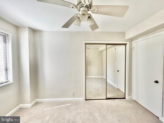 3819 Davis Place Northwest, Unit 1 Washington, DC 20007 - Photo 14 of 18 an empty room with fan and windows