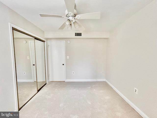 3819 Davis Place Northwest, Unit 1 Washington, DC 20007 - Photo 15 of 18 an empty room with a ceiling fan and a glass door