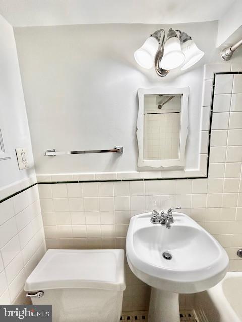 3819 Davis Place Northwest, Unit 1 Washington, DC 20007 - Photo 17 of 18 a bathroom with a sink toilet and mirror