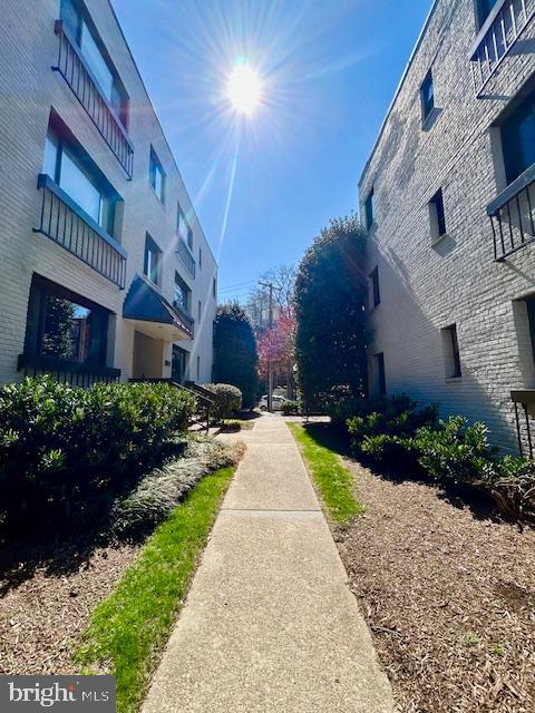 3819 Davis Place Northwest, Unit 1 Washington, DC 20007 - Photo 2 of 18 a view of a building with a yard