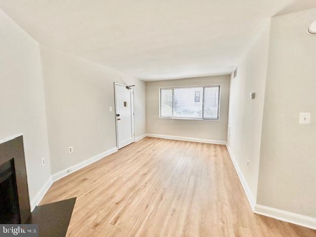 3819 Davis Place Northwest, Unit 1 Washington, DC 20007 - Photo 3 of 18 an empty room with wooden floor and windows