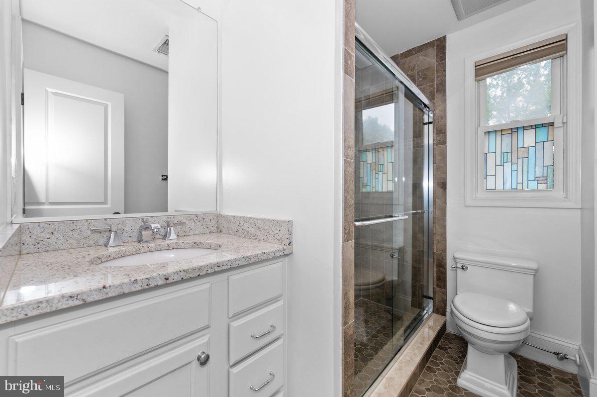 6 East Hamilton Avenue Silver Spring, MD 20901 - Photo 15 of 47 Main level beautiful tiled bathroom with shower