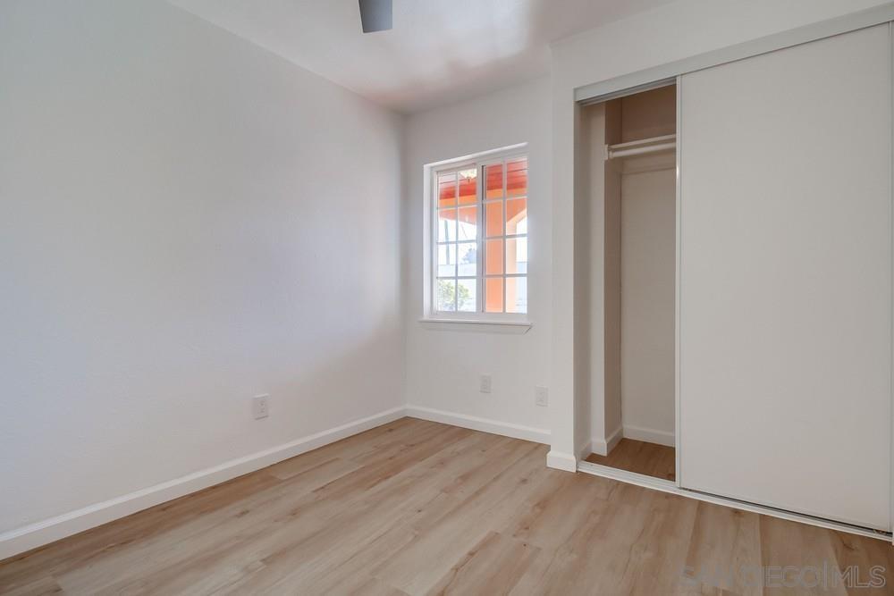 796 West Washington Avenue El Cajon, CA 92020 - Photo 16 of 71 an empty room with wooden floor and windows