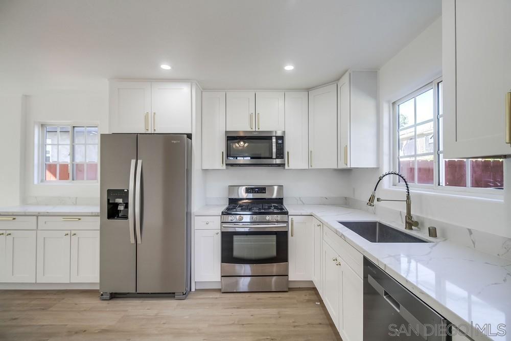 796 West Washington Avenue El Cajon, CA 92020 - Photo 40 of 71 a kitchen with a refrigerator stove and sink