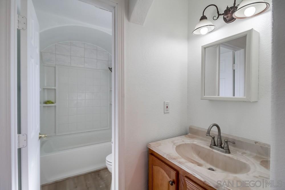 796 West Washington Avenue El Cajon, CA 92020 - Photo 54 of 71 a bathroom with a sink and a mirror