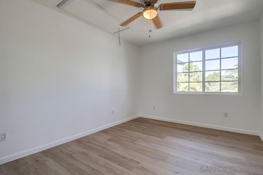 796 West Washington Avenue El Cajon, CA 92020 - Photo 59 of 71 an empty room with a window and a fan